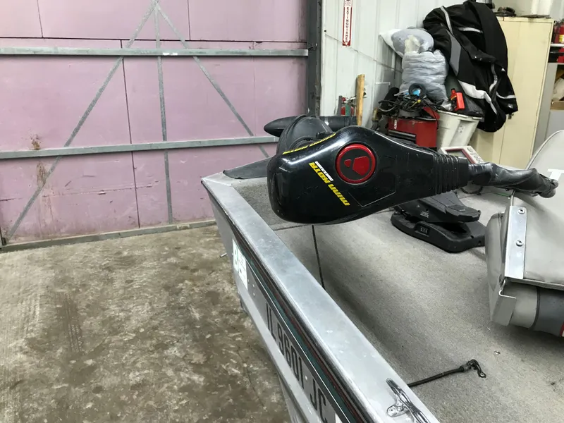 Slide: The Image of 1997 Bass Tracker Pro Team 175 boat in a garage setting. - 11