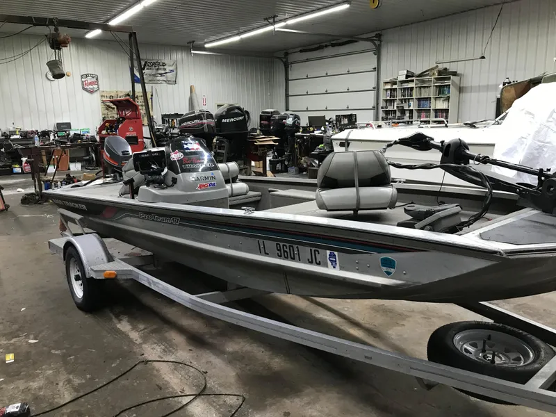 Slide: The Image of 1997 Bass Tracker Pro Team 175 boat in a workshop setting. - 3