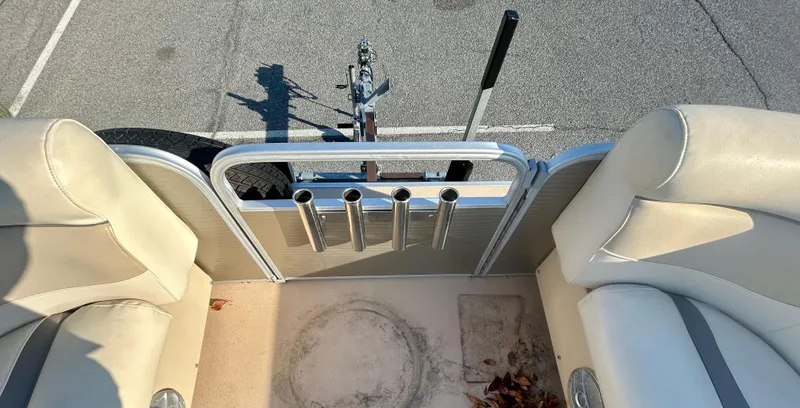 Slide: The Image of Interior view of 2016 Godfrey SWEETWATER 200 boat with beige seating and rod holders. - 13