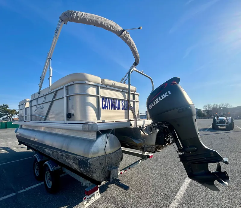 Slide: The Image of 2016 Godfrey SWEETWATER 200 pontoon boat with Suzuki outboard motor on trailer. - 14