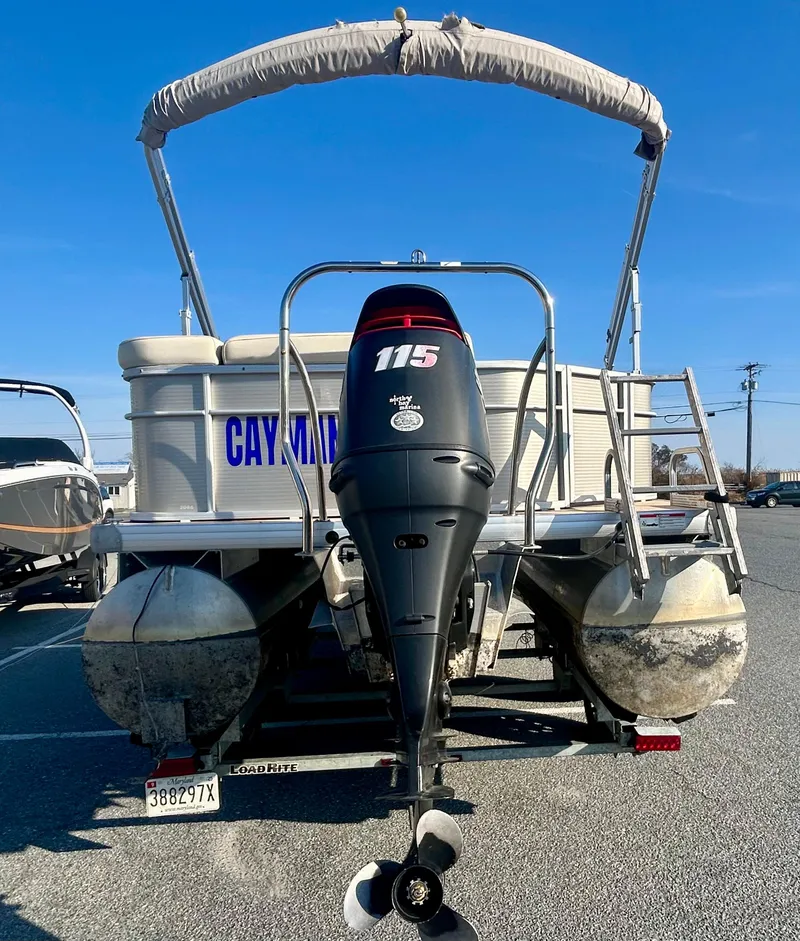 Slide: The Image of 2016 Godfrey SWEETWATER 200 pontoon boat with 115 HP outboard motor, parked outdoors. - 15