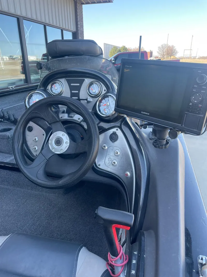 Slide: The Image of 2020 Tracker PT175 boat dashboard with steering wheel and electronic display. - 7