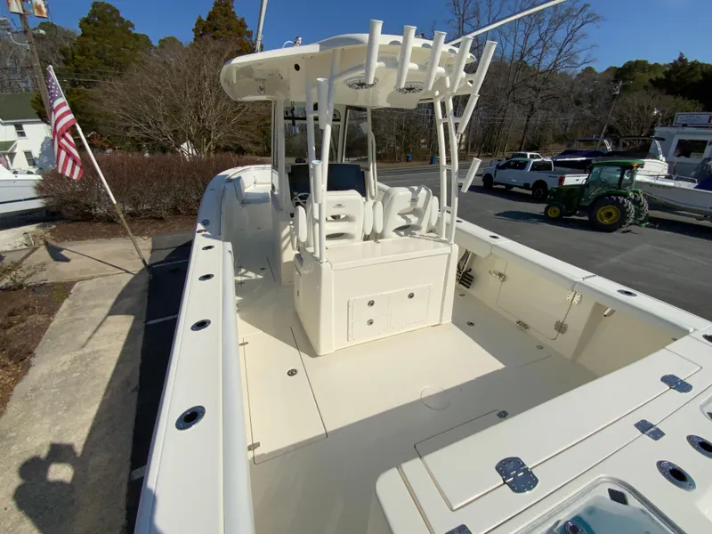 Slide: The Image of 2025 Cobia 320 Center Console boat with spacious deck and seating. - 11