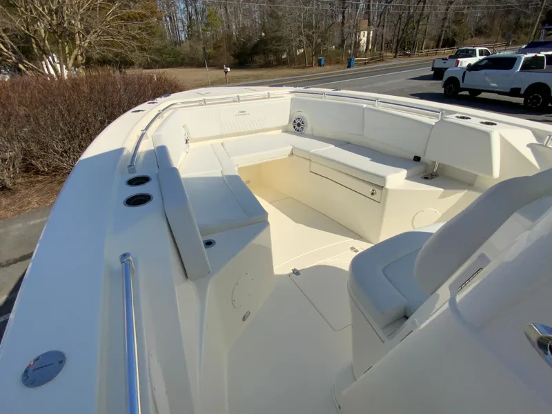 Slide: The Image of 2025 Cobia 320 Center Console boat with spacious seating and sleek design. - 24