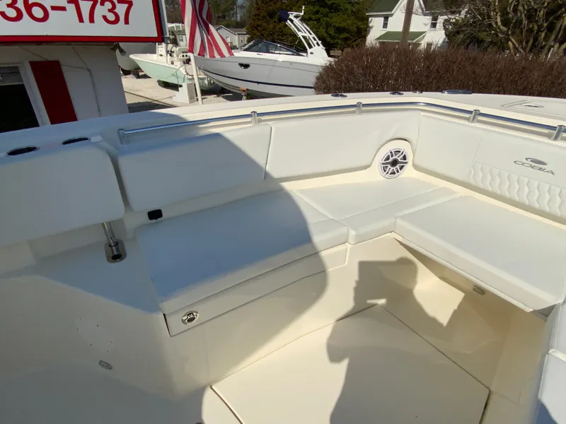 Slide: The Image of 2025 Cobia 320 Center Console boat interior with seating and speaker. - 26