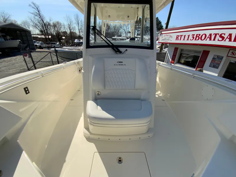 Slide: The Image of 2025 Cobia 320 Center Console boat interior with seating and helm station. - 33