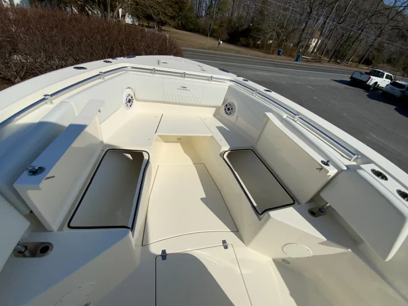 Slide: The Image of 2025 Cobia 320 Center Console boat interior with spacious seating and storage compartments. - 37