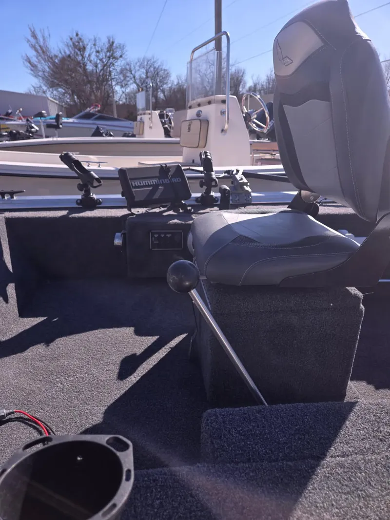 Slide: The Image of 2023 Lowe Skorpion 16 boat interior with seating and control panel. - 6