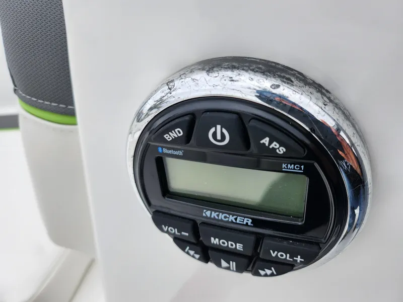 Slide: The Image of Close-up of Kicker audio control panel on 2023 Tahoe T16 boat. - 14