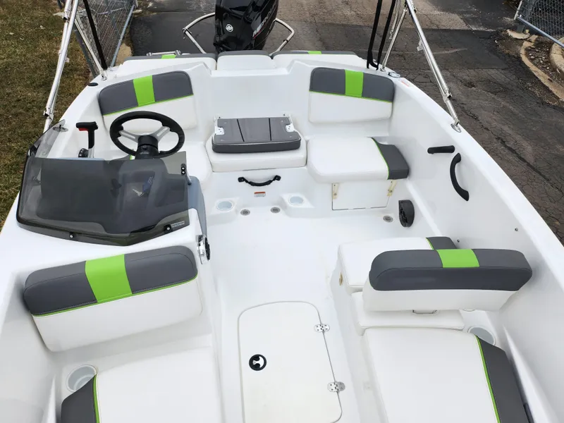 Slide: The Image of 2023 Tahoe T16 boat interior with modern seating and steering wheel. - 18