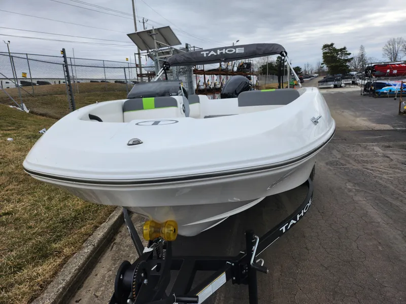 Slide: The Image of 2023 Tahoe T16 boat on trailer, white exterior, parked outdoors. - 6