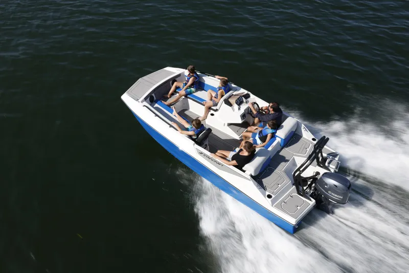 Slide: The Image of 2025 Starcraft SV 16 OB boat cruising on water with passengers enjoying the ride. - 19