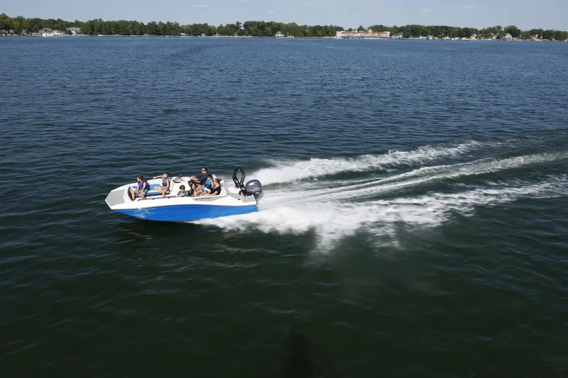Slide: The Image of 2025 Starcraft SV 16 OB boat cruising on a lake with passengers. - 21