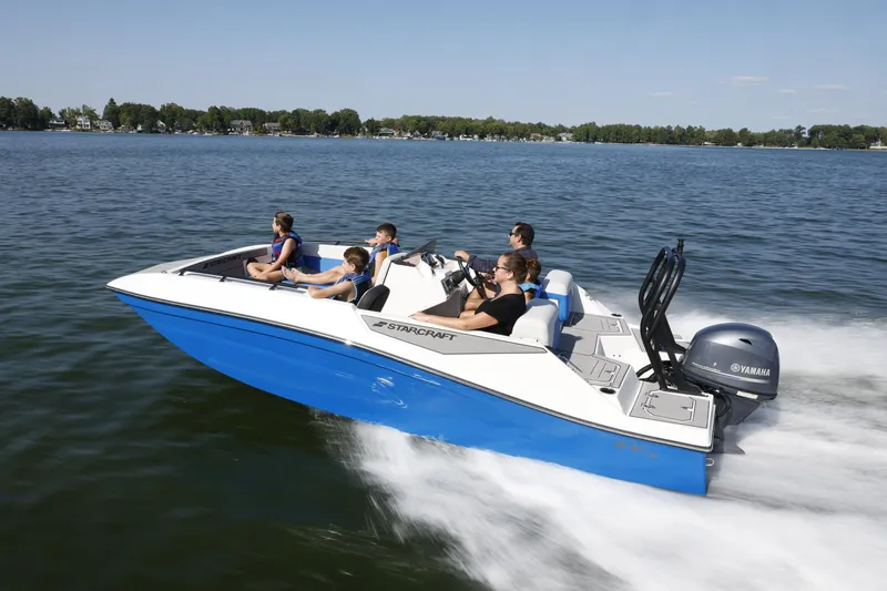 Slide: The Image of 2025 Starcraft SV 16 OB boat cruising on a lake with passengers enjoying the ride. - 26