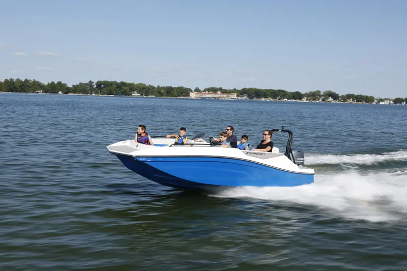 Slide: The Image of 2025 Starcraft SV 16 OB boat cruising on a lake with passengers enjoying the ride. - 27