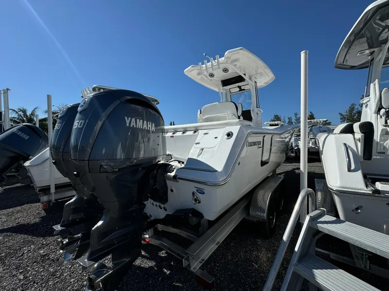 Slide: The Image of 2025 Tidewater 256 LXF boat with Yamaha engine, displayed outdoors on a trailer. - 5