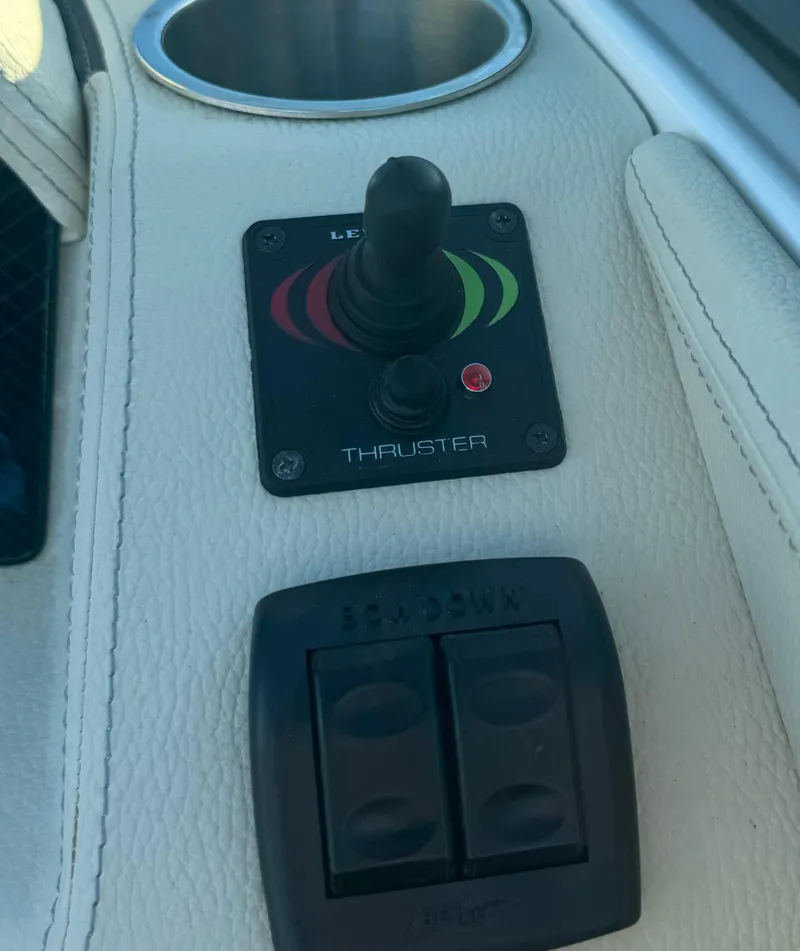 Slide: The Image of Control panel of a 2021 Regal 2800 Bowrider boat with thruster joystick. - 18