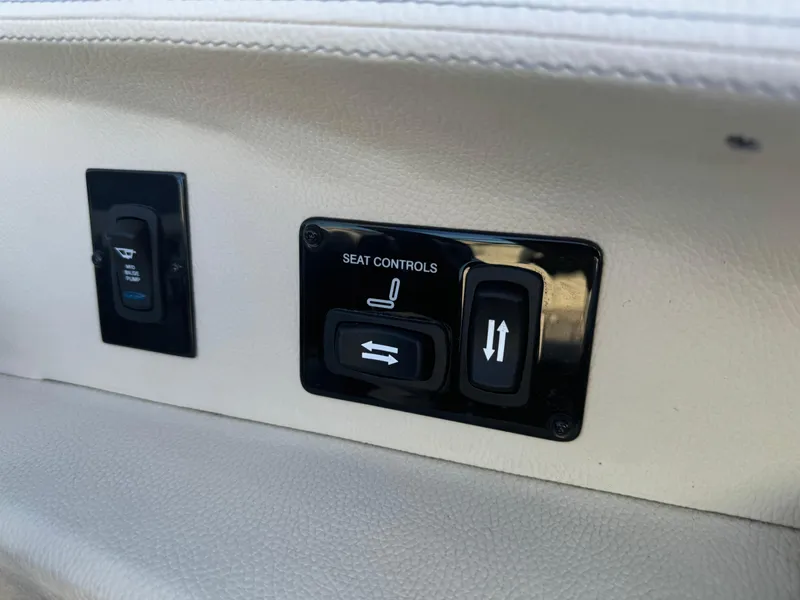 Slide: The Image of Seat controls on 2021 Regal 2800 Bowrider boat, featuring adjustable settings. - 20