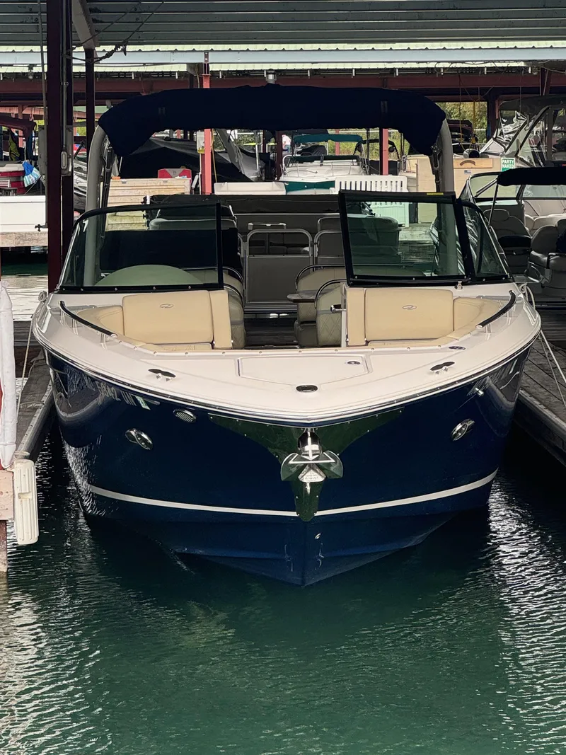 Slide: The Image of 2021 Regal 2800 Bowrider boat docked in marina, front view. - 37