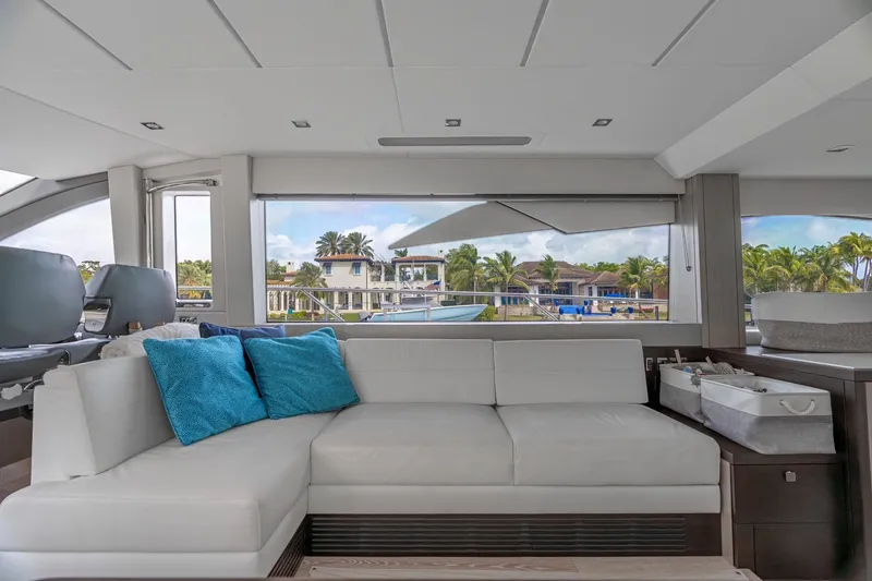 Slide: The Image of 2019 Sunseeker Manhattan 66 yacht cruising on open water. - 10