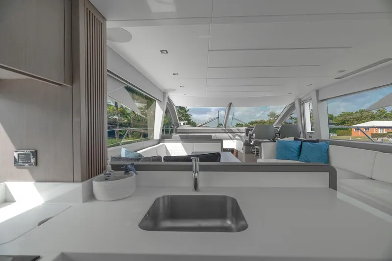 Slide: The Image of Interior view of 2019 Sunseeker Manhattan 66 yacht cockpit with modern controls and luxurious seating. - 11