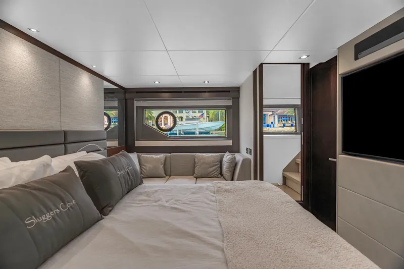 Slide: The Image of Luxurious interior of 2019 Sunseeker Manhattan 66 yacht with white sofa and blue cushions. - 13