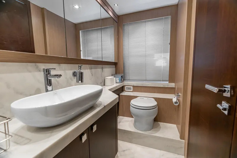 Slide: The Image of Staircase on 2019 Sunseeker Manhattan 66 yacht with teak decking and stainless steel railings. - 22