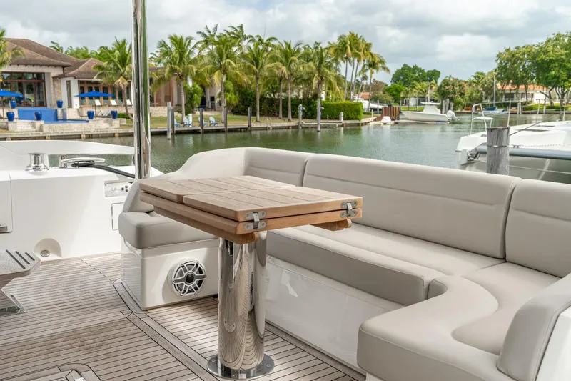 Slide: The Image of Flybridge of 2019 Sunseeker Manhattan 66 yacht with luxurious seating and control panel. - 23