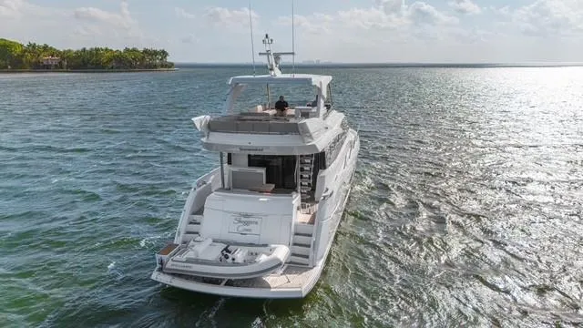 Slide: The Image of 2019 Sunseeker Manhattan 66 yacht cruising on open water, aerial view. - 3