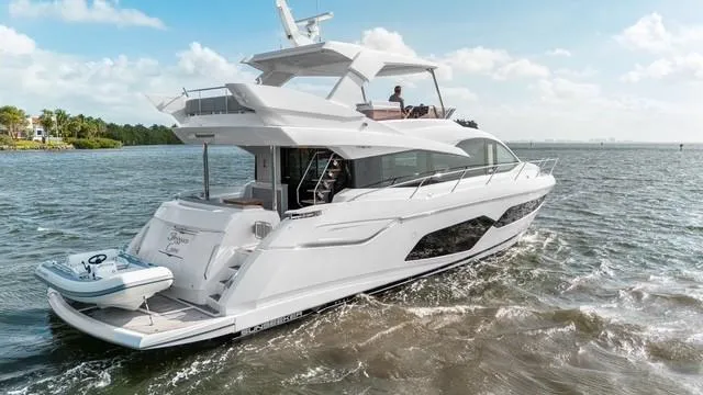 Slide: The Image of Aerial view of 2019 Sunseeker Manhattan 66 yacht cruising on green water. - 4