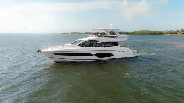 Slide: The Image of Luxury Sunseeker Manhattan 66 yacht cruising on open water, 2019 model. - 7