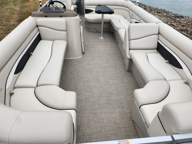Slide: The Image of 2019 Bennington SX 22 Cruise and Fish boat interior with beige seating and carpet. - 10