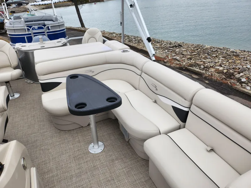 Slide: The Image of 2019 Bennington SX 22 Cruise and Fish pontoon boat with beige seating and black table. - 12