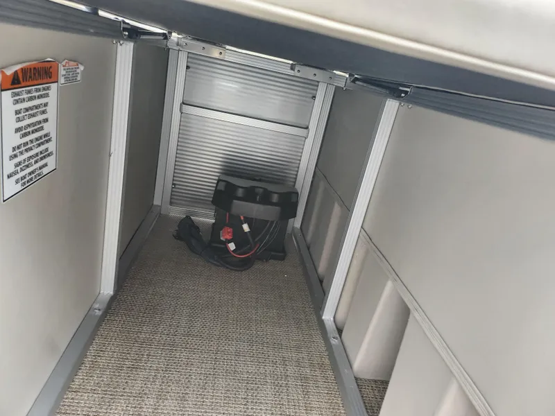 Slide: The Image of 2019 Bennington SX 22 Cruise and Fish under-seat storage with battery compartment. - 16