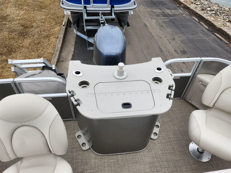 Slide: The Image of 2019 Bennington SX 22 Cruise and Fish boat interior with seating and control panel. - 17