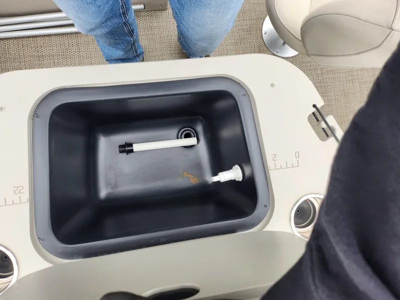 Slide: The Image of 2019 Bennington SX 22 Cruise and Fish boat interior with built-in storage compartment. - 18