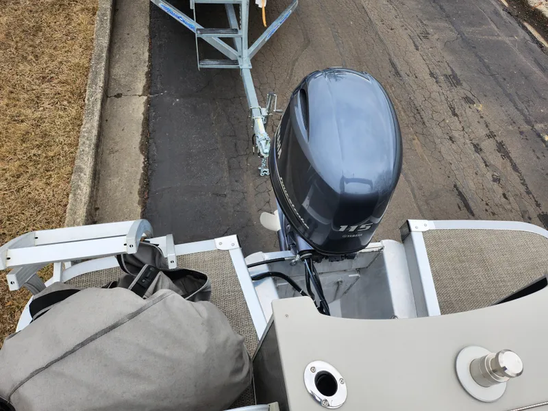 Slide: The Image of 2019 Bennington SX 22 Cruise and Fish boat with outboard motor on trailer. - 19