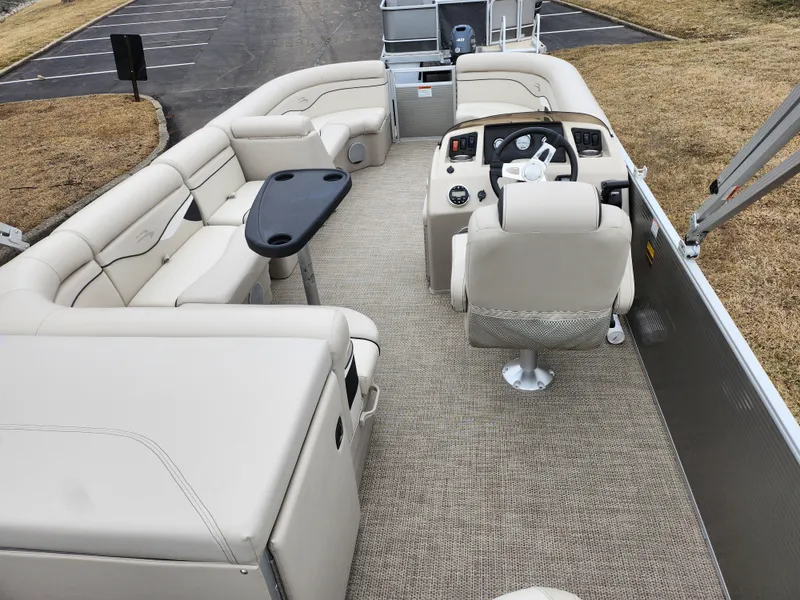 Slide: The Image of 2019 Bennington SX 22 Cruise and Fish pontoon boat interior with beige seating and helm. - 21