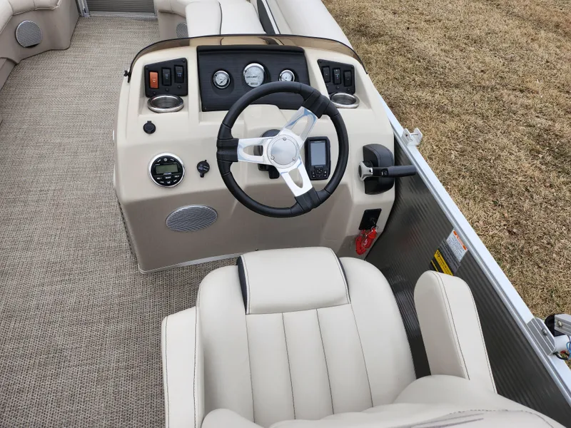 Slide: The Image of 2019 Bennington SX 22 Cruise and Fish boat interior with steering wheel and controls. - 23