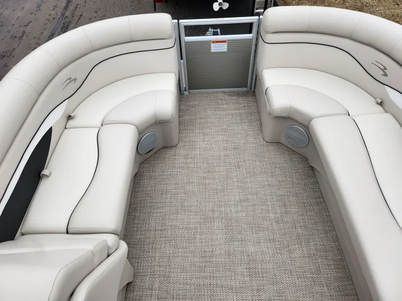 Slide: The Image of 2019 Bennington SX 22 Cruise and Fish boat interior with beige seating and carpet flooring. - 26