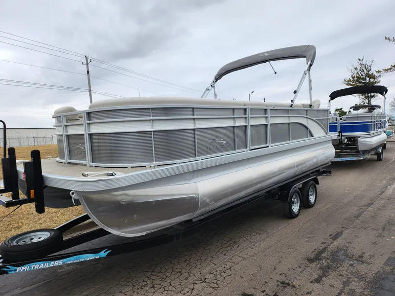Slide: The Image of 2019 Bennington SX 22 Cruise and Fish pontoon boat on trailer, overcast day. - 5