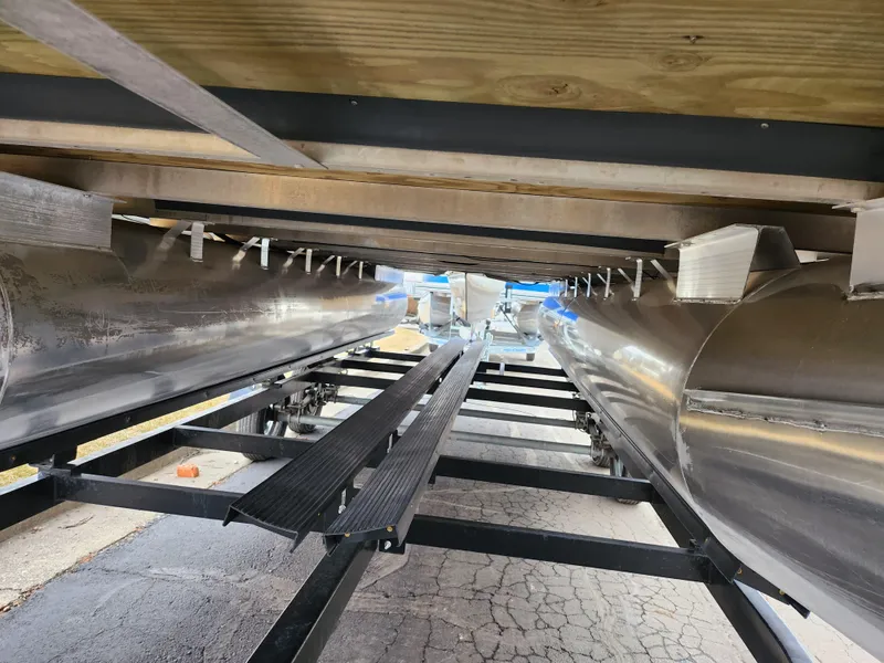 Slide: The Image of Underneath view of a 2019 Bennington SX 22 Cruise and Fish pontoon boat on a trailer. - 7