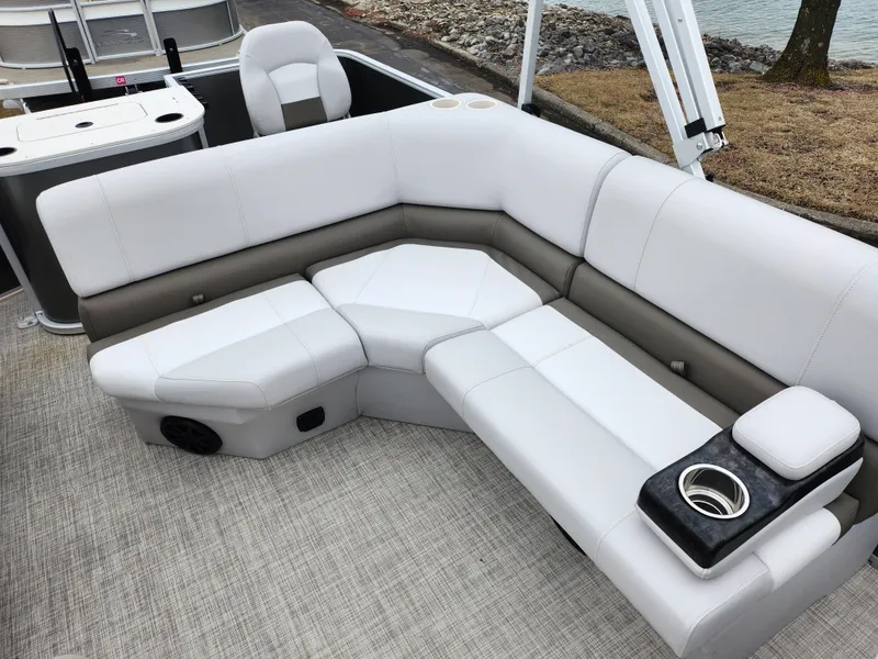 Slide: The Image of 2019 SunCatcher V16 Fish boat interior with plush seating and cup holders. - 12