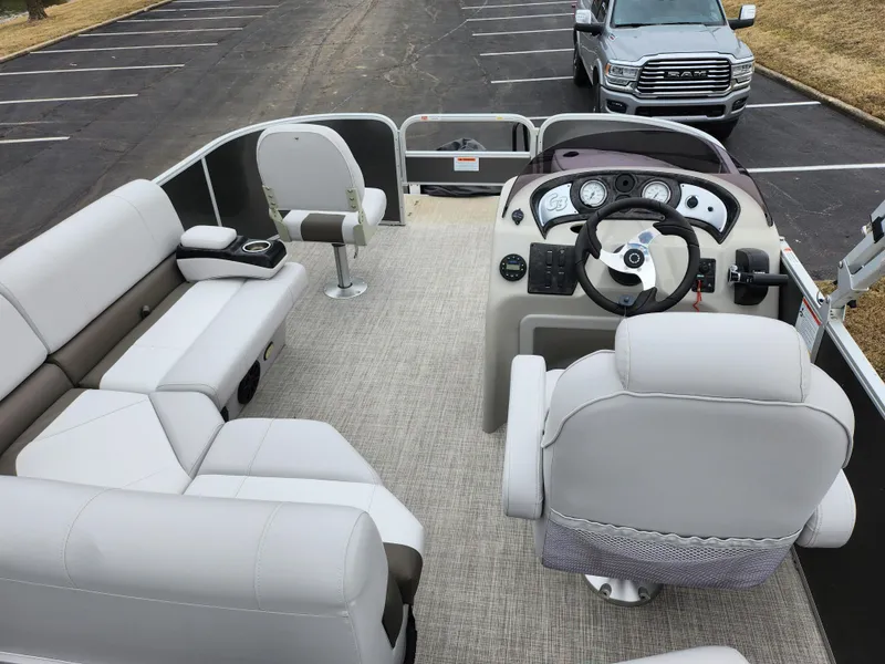 Slide: The Image of 2019 SunCatcher V16 Fish pontoon boat interior with seating and steering console. - 18