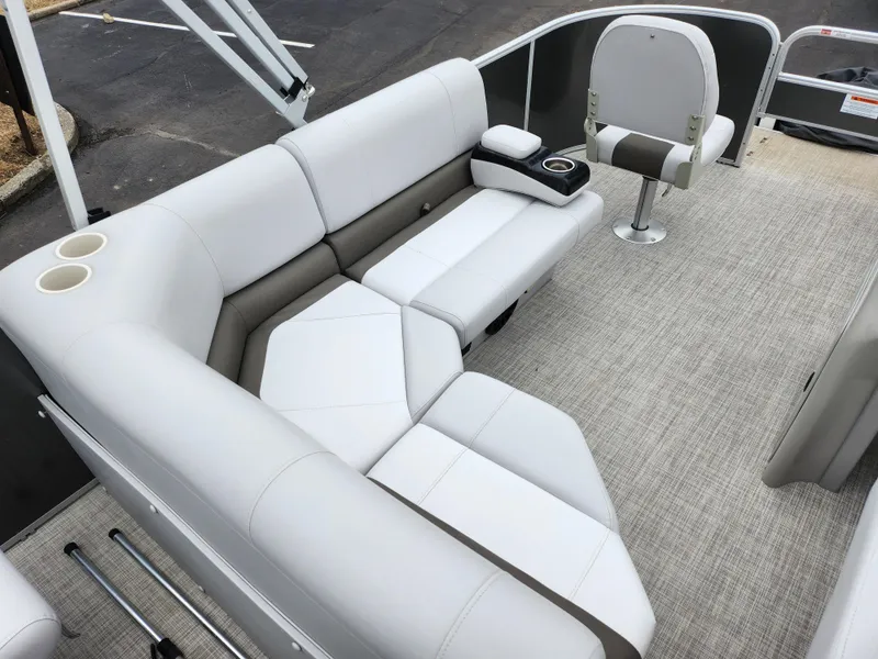 Slide: The Image of 2019 SunCatcher V16 Fish boat interior with cushioned seating and cup holders. - 19