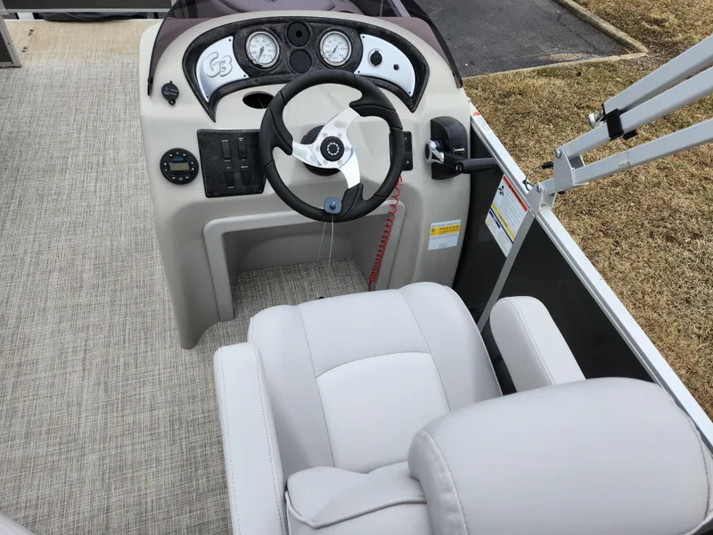 Slide: The Image of 2019 SunCatcher V16 Fish boat dashboard with steering wheel and controls. - 20