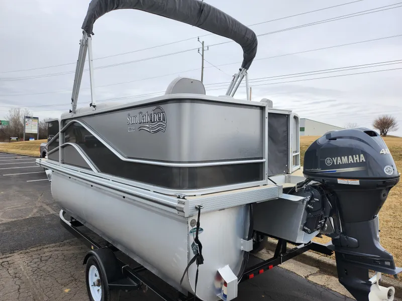 Slide: The Image of 2019 SunCatcher V16 Fish pontoon boat with Yamaha outboard motor on trailer. - 3