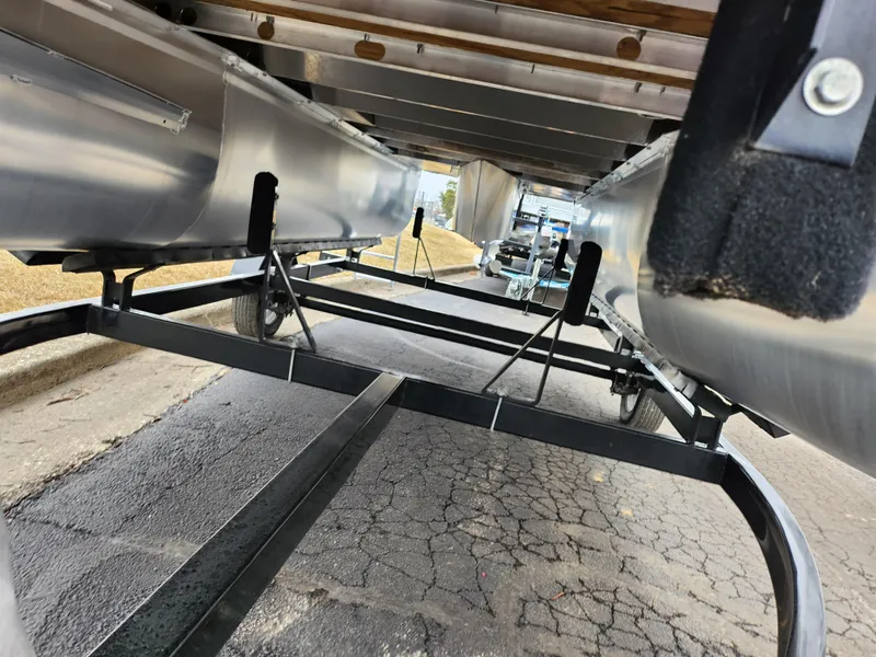 Slide: The Image of Underneath view of a 2019 SunCatcher V16 Fish pontoon boat on a trailer. - 7