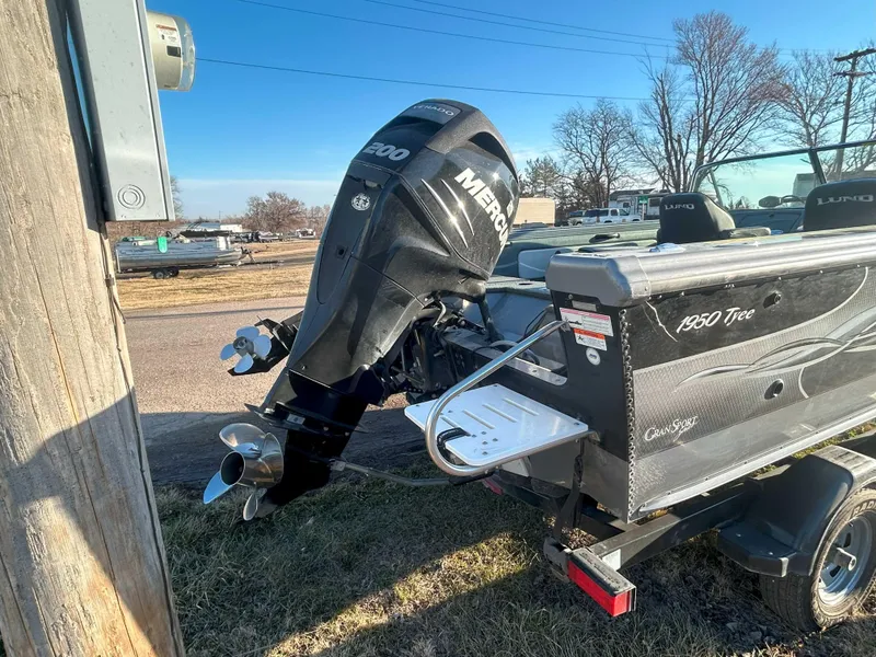 Slide: The Image of 2009 Lund 1950 Tyee Grand Sport boat with Mercury outboard motor on trailer. - 4