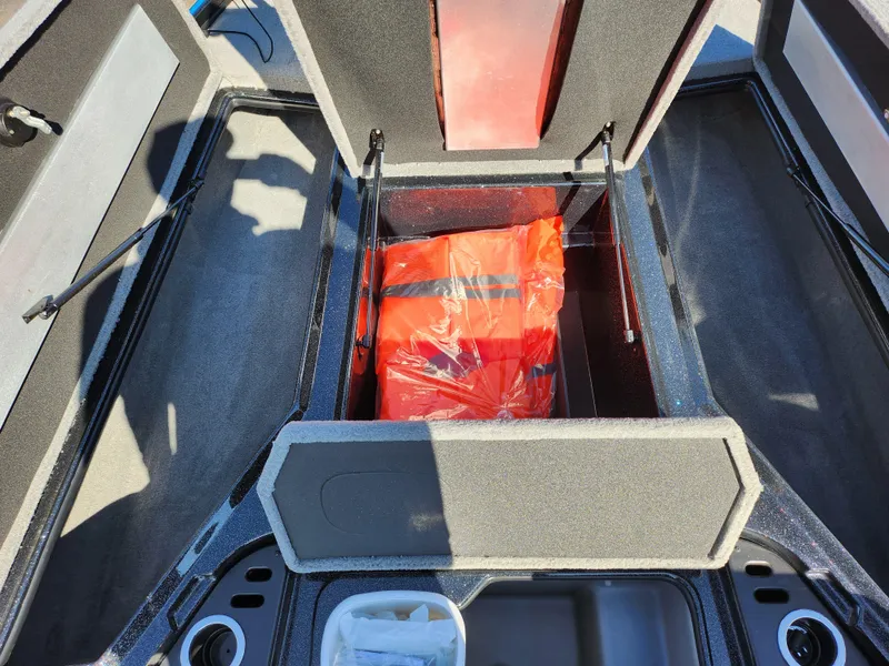 Slide: The Image of 2021 Nitro Z18 Pro boat storage compartment with life jacket. - 16